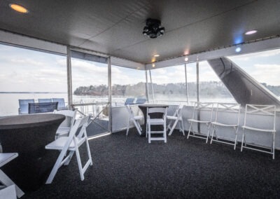 Enclosed upper back deck with LED lighting on The Stardust luxury houseboat near Lanier Islands