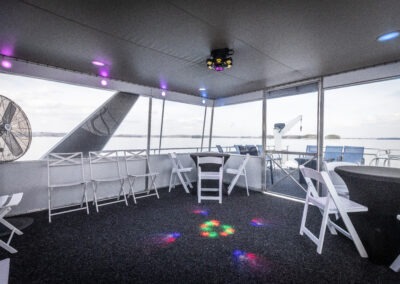 Enclosed top back deck with LED party lights on The Stardust luxury houseboat near Lanier Islands Georgia