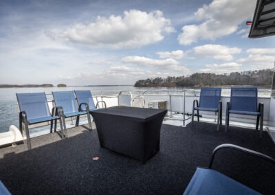Open top back deck on The Stardust luxury houseboat with panoramic water views on Lake Lanier