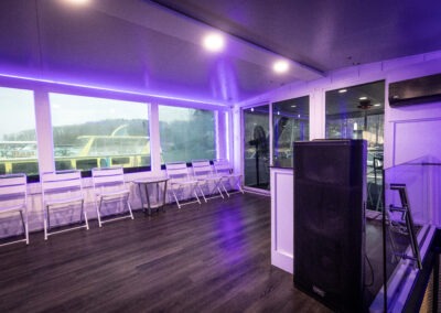 LED lit enclosed top deck lounge with DJ Booth on The Stardust luxury houseboat with heating and air conditioning