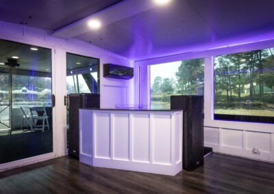 Mid deck party area with DJ booth and bar on The Stardust luxury houseboat cruising Lake Lanier