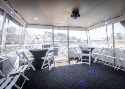 Enclosed top back deck with LED lights on The Stardust luxury houseboat overlooking Lake Lanier