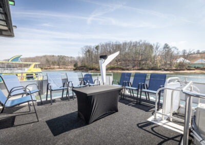 Open top back deck seating area on The Stardust luxury houseboat overlooking Lake Lanier