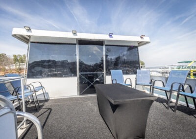Top rear deck on The Stardust luxury houseboat overlooking the water near Lanier Islands Georgia
