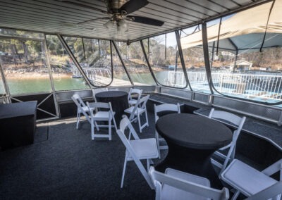Front deck meeting area on The Stardust luxury houseboat with seating for private gatherings on Lake Lanier