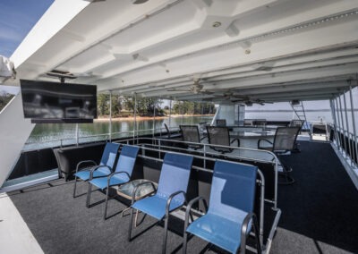 Upper deck celebration space on the Fantasy luxury houseboat cruising Lake Lanier Georgia