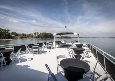 Rooftop deck seating on the Fantasy luxury houseboat with panoramic views of Lake Lanier