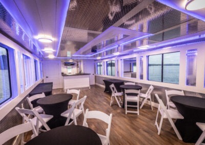 comfortable lounge seating inside the Little Luxury luxury houseboat for relaxing Lake Lanier cruise experiences